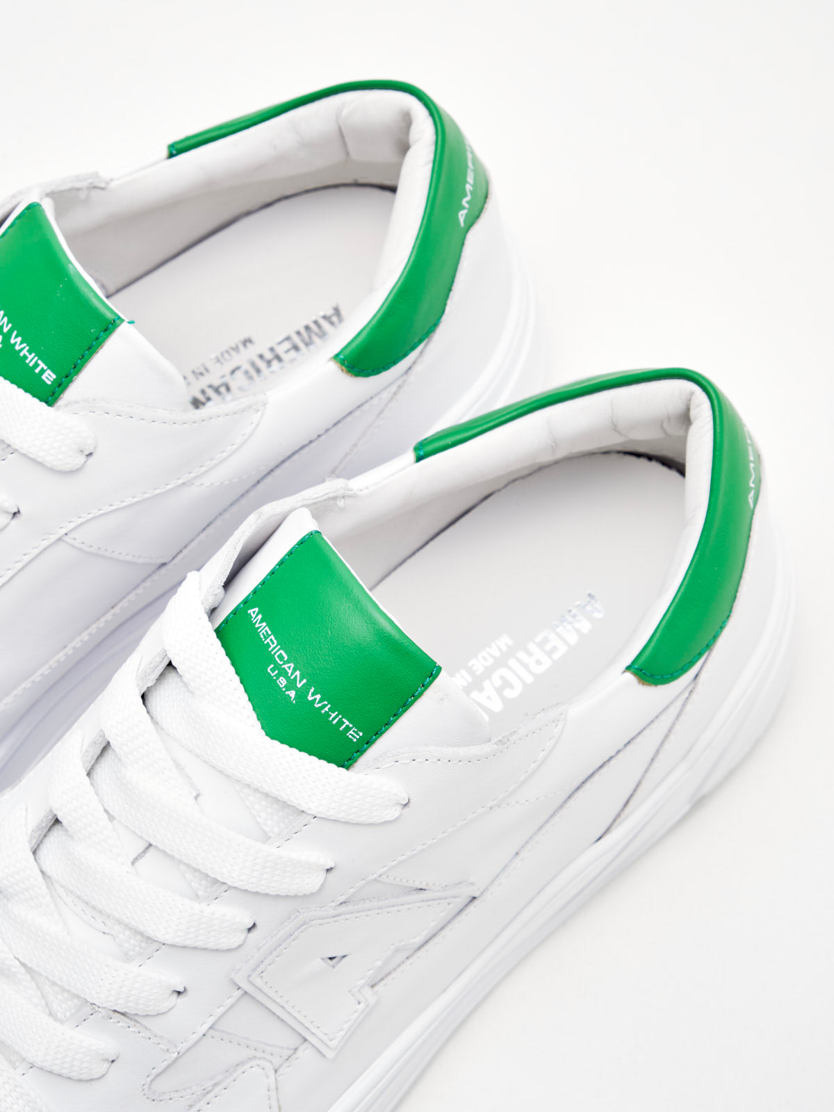 American White Man Emmeuno Logo white green