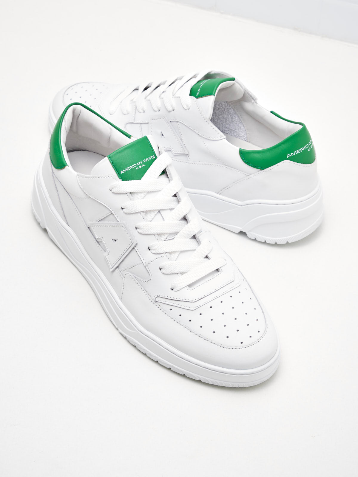 American White Man Emmeuno Logo white green